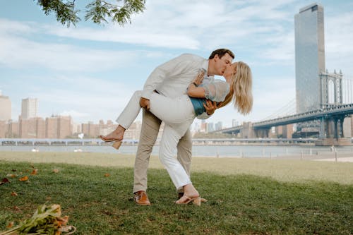 Photo of Man Kissing a Woman