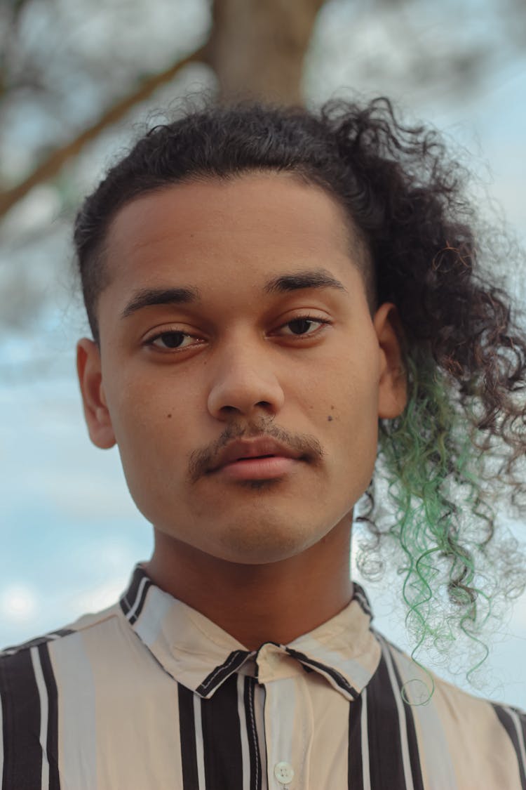 Portrait Of Young Man With Curly Hair