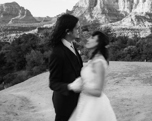 Groom and Bride Dancing on Cliff