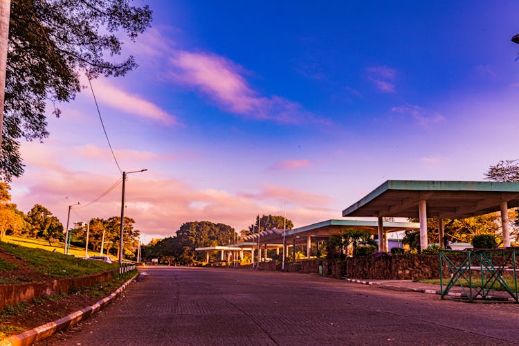 Clouds Over Empty Road In Village