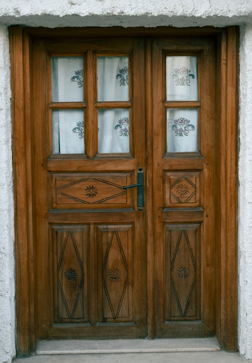 Brown Wooden Door on Concrete Wall