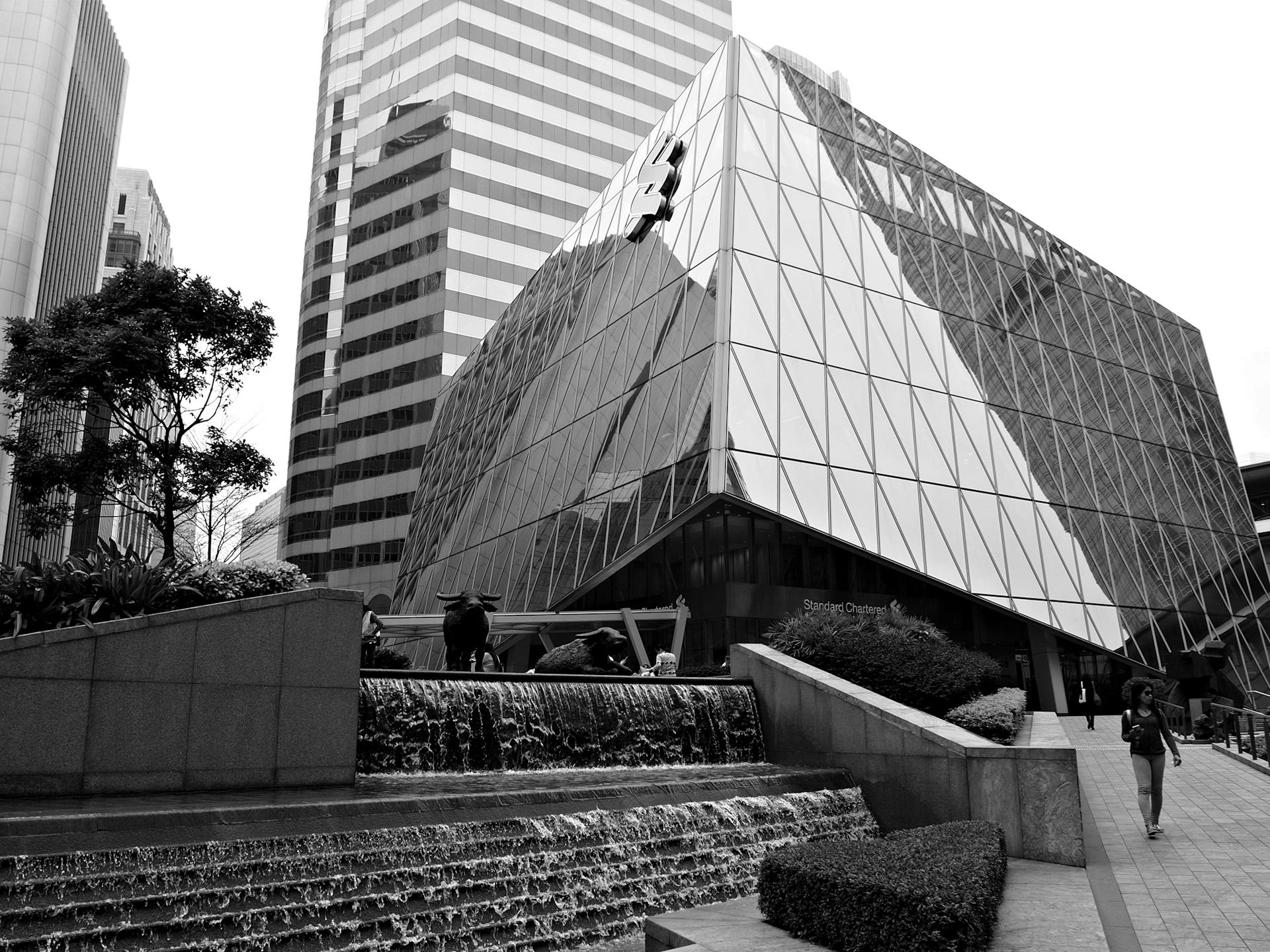 A contemporary black and white photo of a modern building in Hong Kong's Exchange Square.