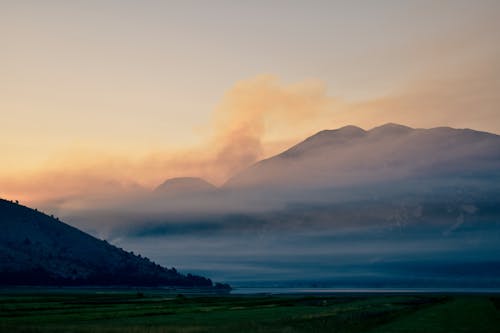 Silhouette of Mountain During Sunset