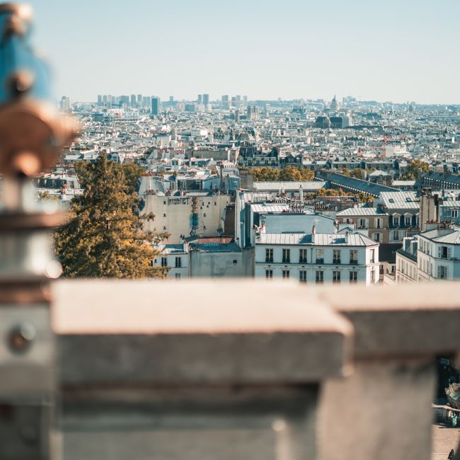 A breathtaking cityscape of Paris, showcasing its iconic architecture and sprawling skyline in beautiful daylight.