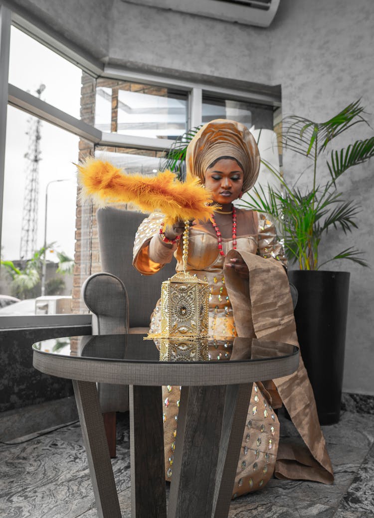 Woman With Traditional Clothes And Decorations In Room