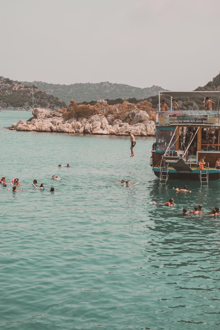 People Swimming At Sea