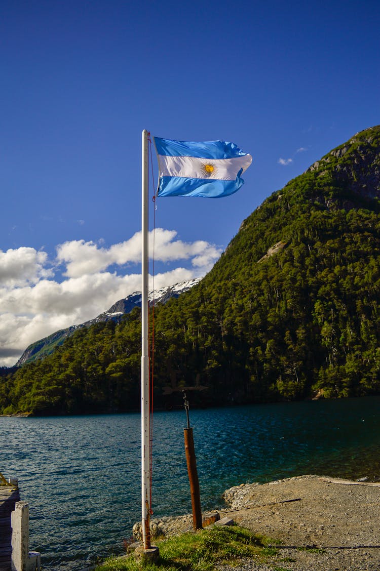 Waving Flag Of Argentian On A Bay 