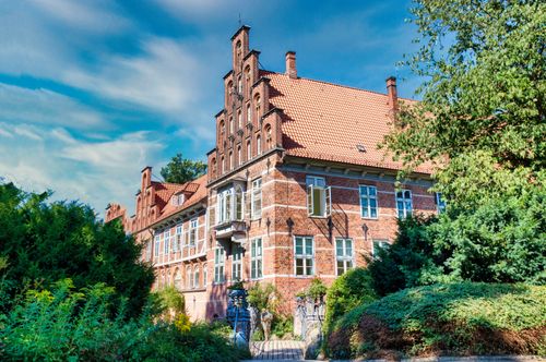 Free Charming view of Bergedorf Castle surrounded by lush greenery in Hamburg, Germany. Stock Photo