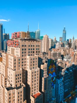 Aerial view of New York City skyline featuring the New Yorker Hotel, showcasing urban architecture.