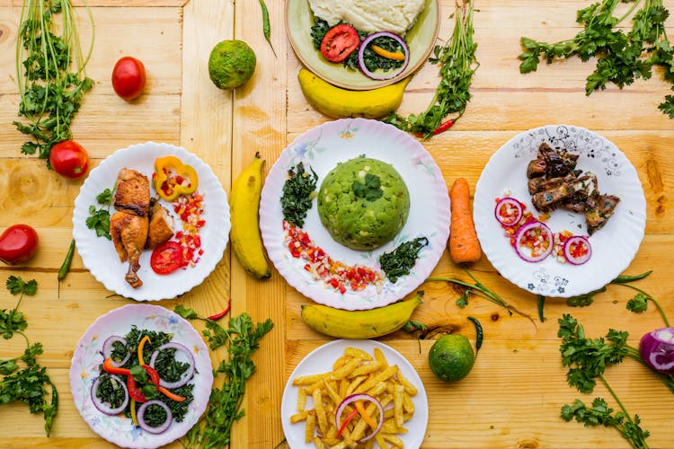 Variety Of Cooked Food On Plates