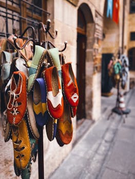 Vibrant handmade shoes displayed in an outdoor market in Gaziantep, Turkey.