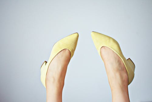 Free Woman Wearing Yellow Pointed-toe Pumps  Stock Photo