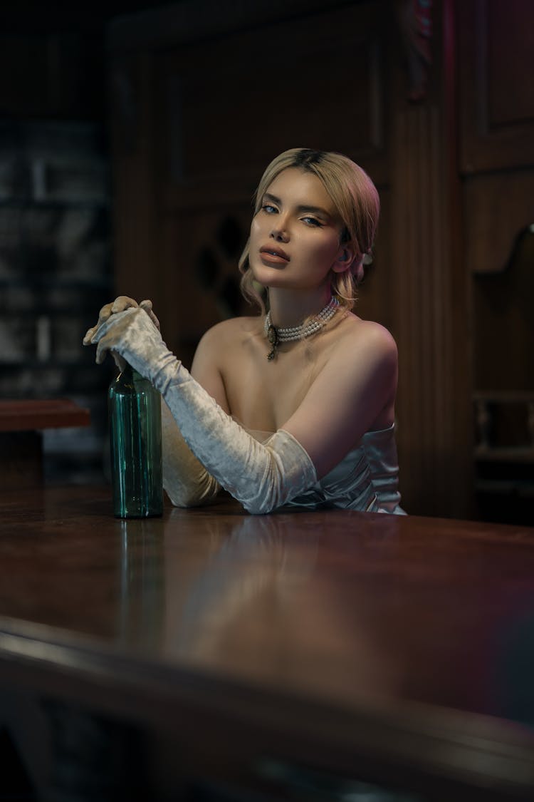 Woman In Retro Clothes Sitting At Bar