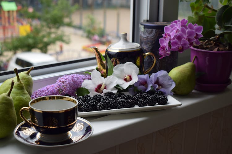 Flowers And Fruits On Window Sill