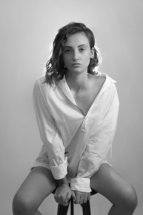 Grayscale Photo of a Woman in a Long Sleeves Posing