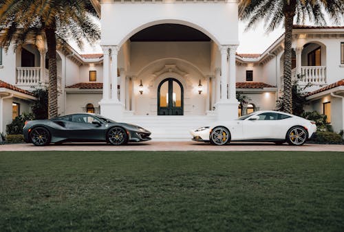 Sportscars in Front of a Mansion
