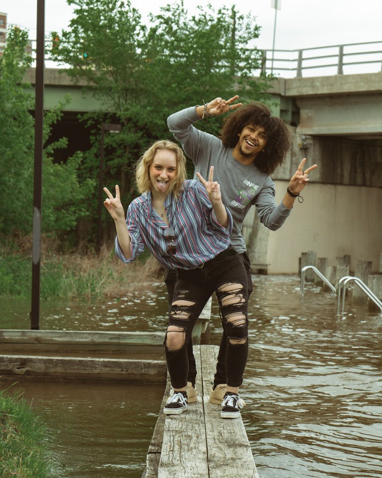 Young Man And Woman Making Funny Faces 