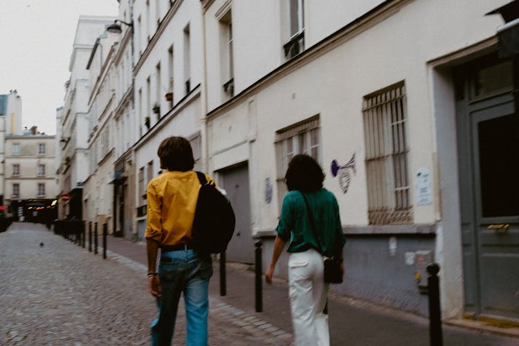 Man And Woman Walking In City