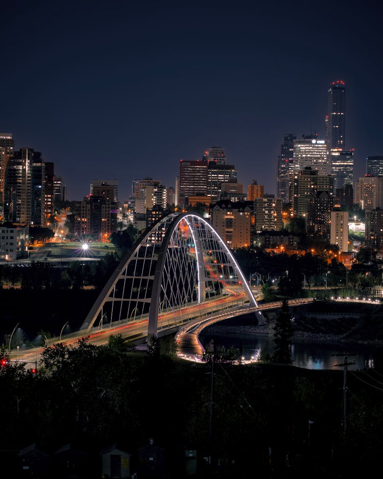 Cityscape With The Illuminated Walterdale Bridge At Night In Edmonton, Canada