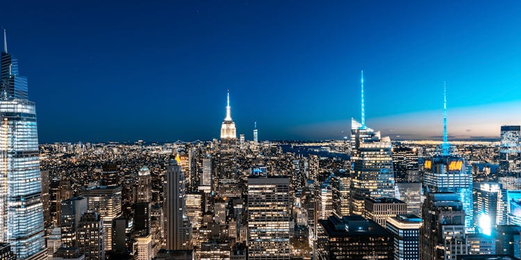 Illuminated Buildings On Skyline