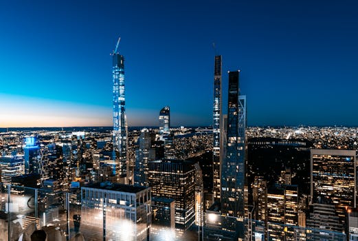 A breathtaking view of New York City's skyline with skyscrapers at night.