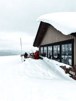 A serene mountain resort covered in snow, offering a picturesque winter escape.