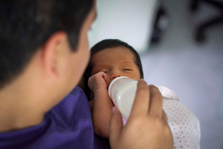 Man Feeding His Baby