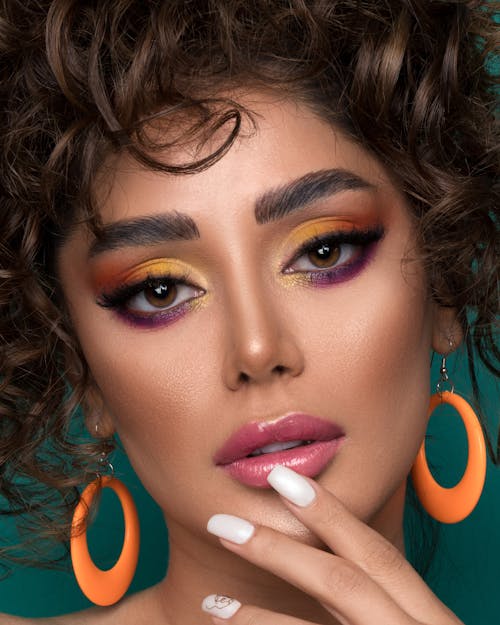Beautiful Woman with Colorful Eye Makeup and Pink Lips