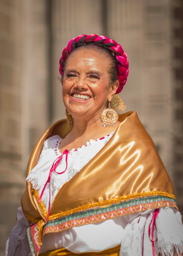 Smiling Old Woman In Traditional Clothes Outdoors