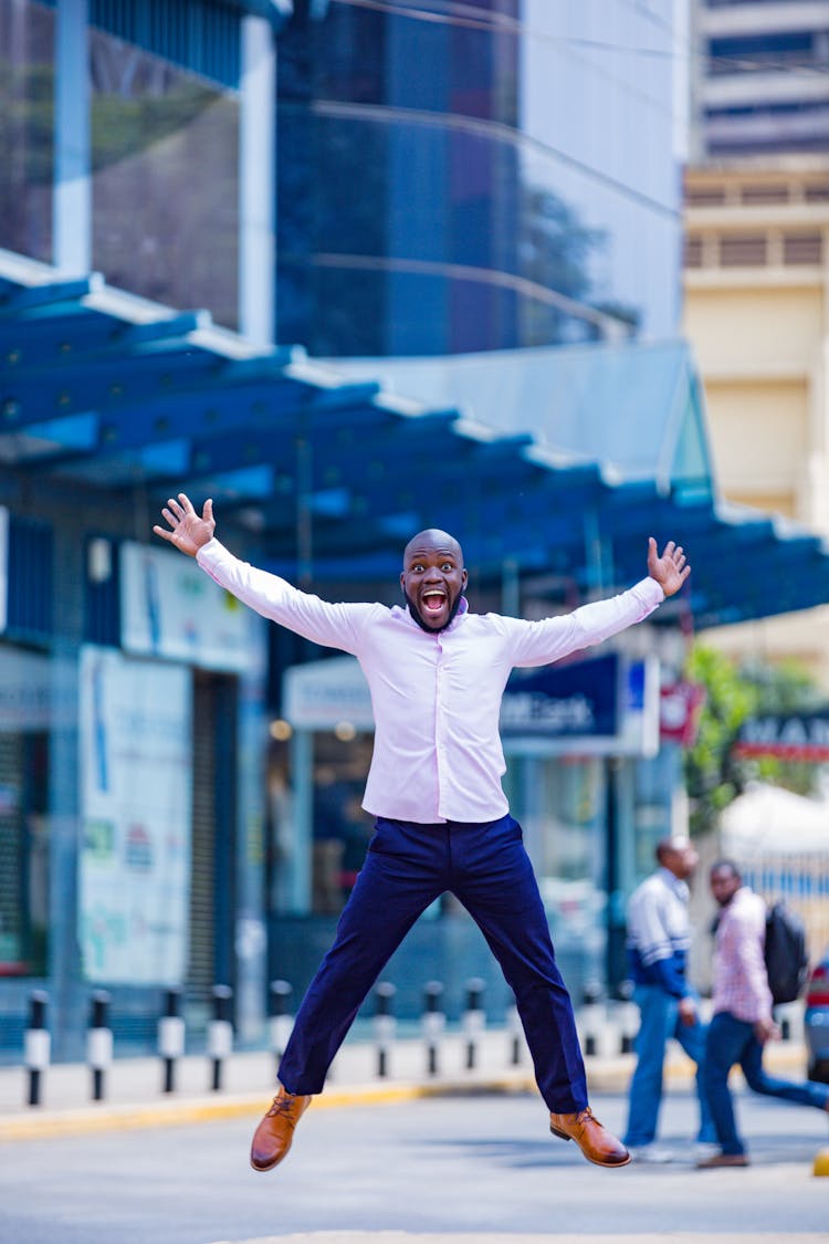 Happy Man Jumping On The Street