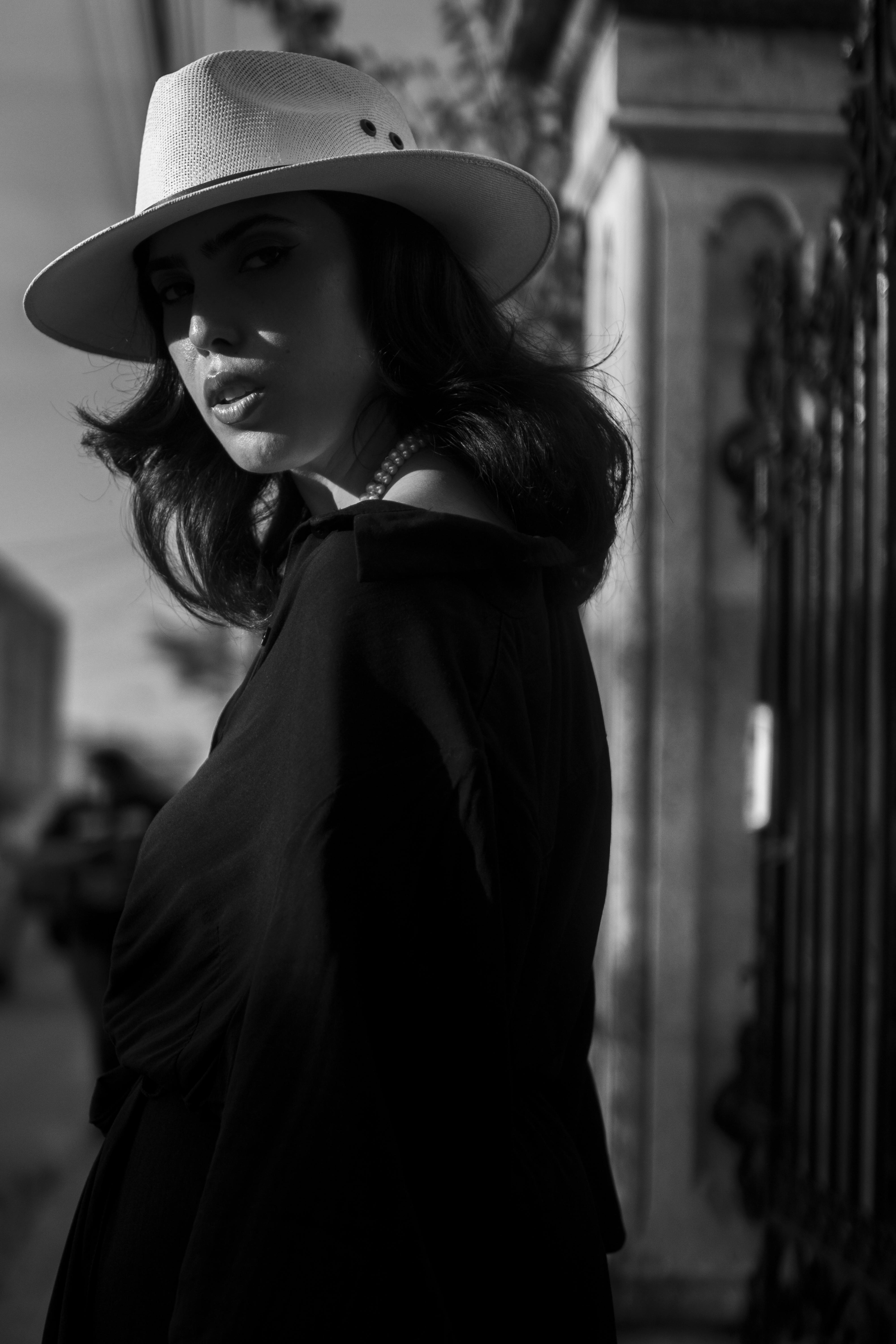 Gray scale Photo of Woman Wearing Fedora Hat and Eyeglasses Covering ...