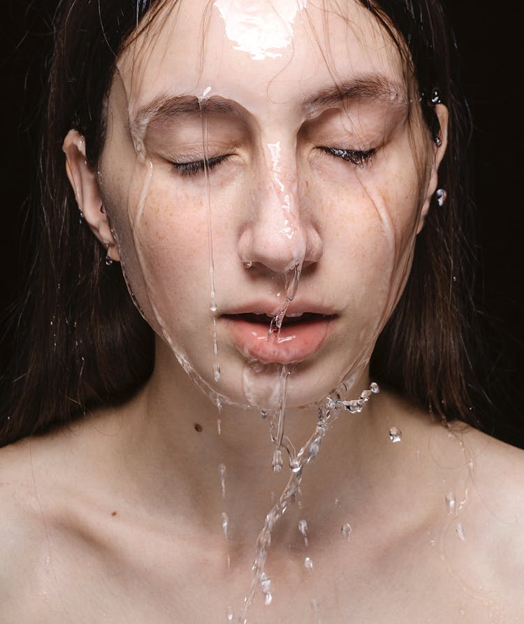 Portrait Of A Woman With Water On Her Face