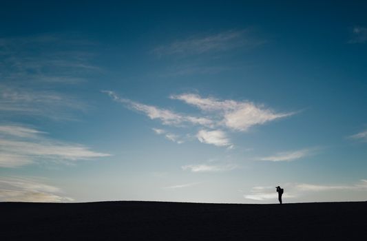 Person Standing Alone on a Desert