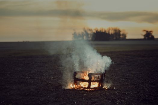 Furniture Burning in Field on Sunset