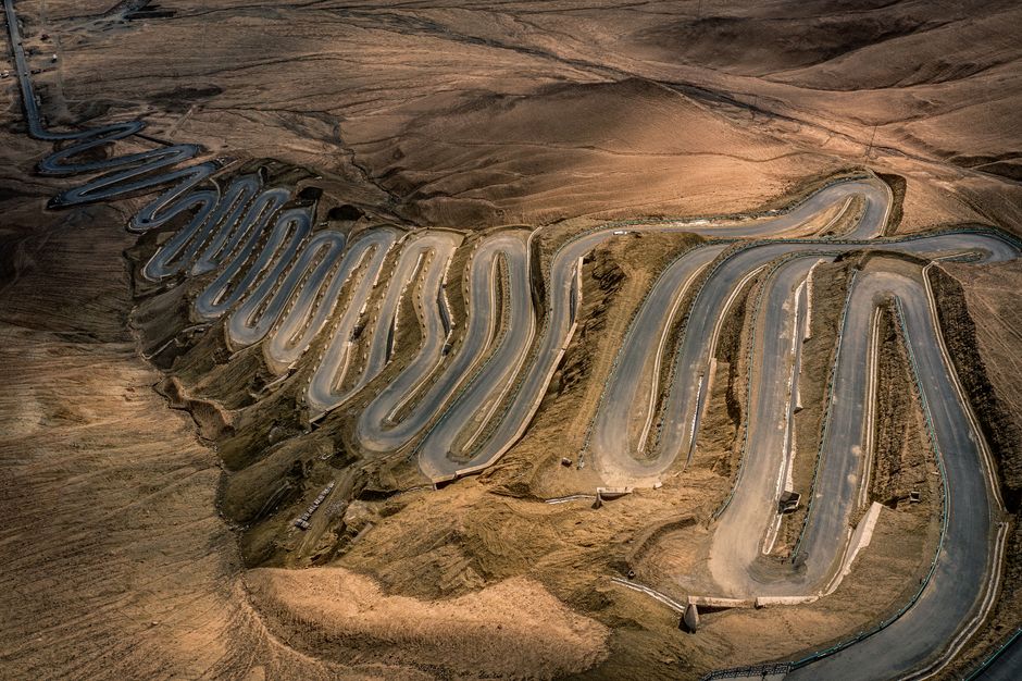A mesmerizing aerial shot of the winding Panlong Ancient Road in Xinjiang, China.