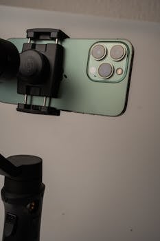 Close-up of a smartphone on a gimbal for stable photography and video.