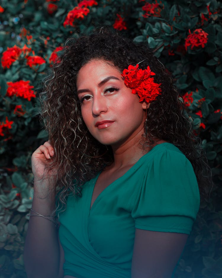 Close Up Photo Of Woman With Red Flowers On Her Hair