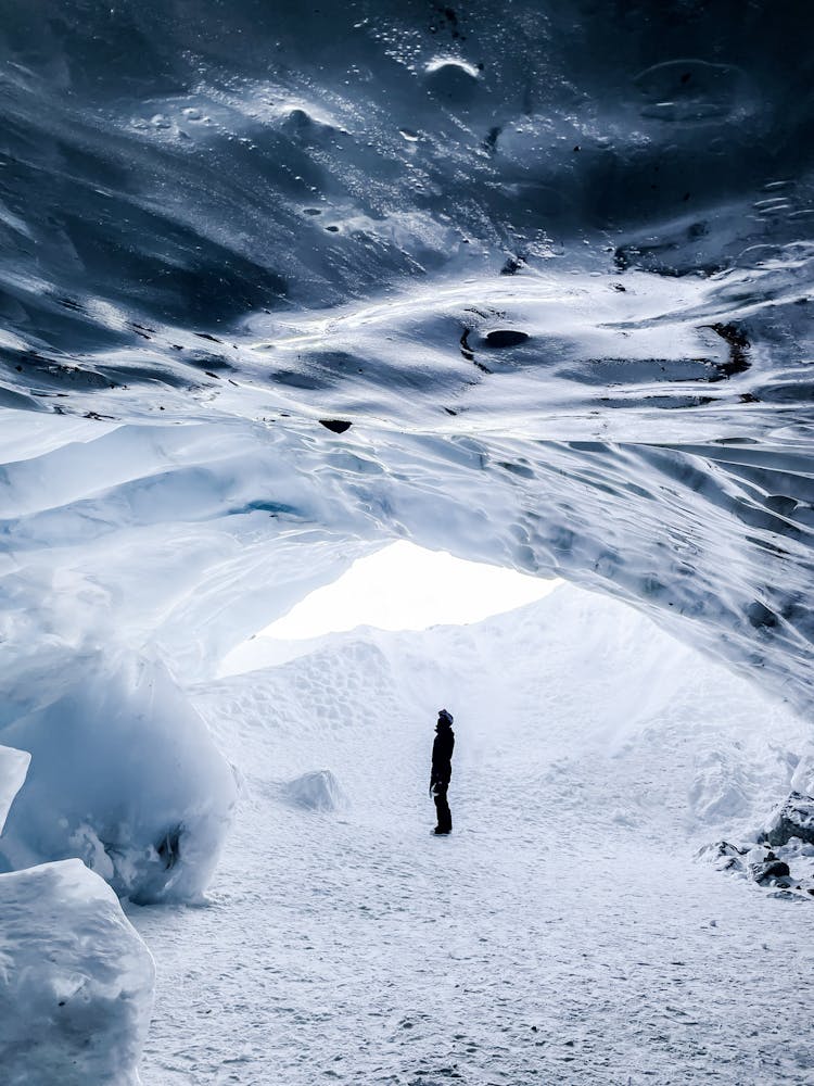 Person Standing In Snow Cave