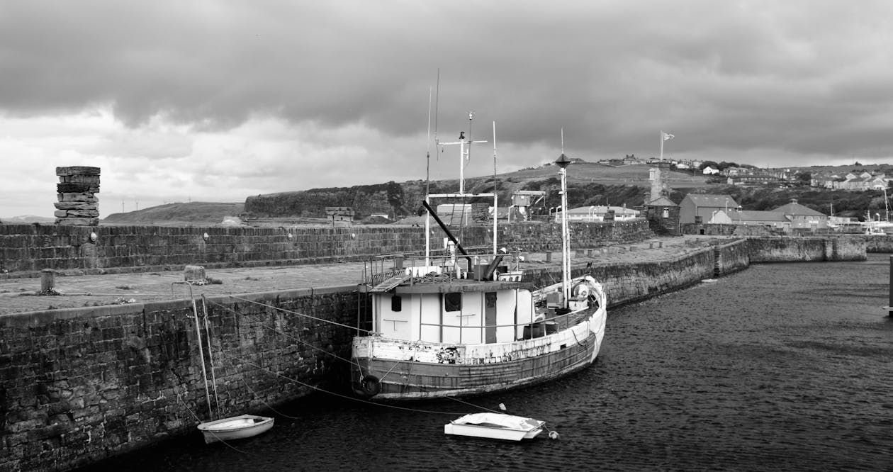 Grayscale Photography of Boat on Dockj