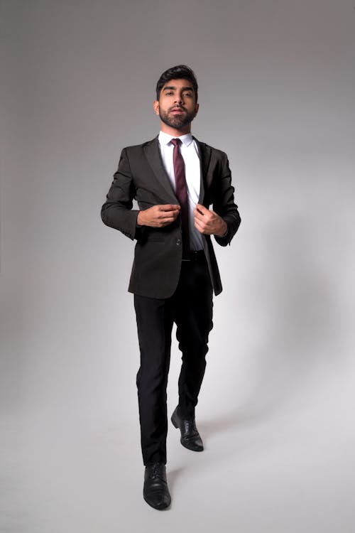 Man in Black Suit Standing