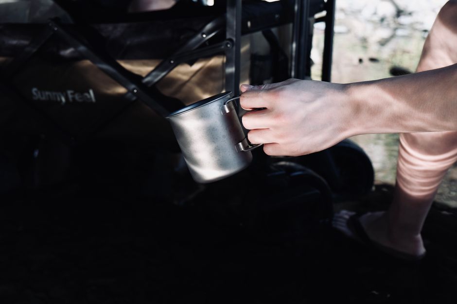 A titanium mug, the ultralight material that tops a failure-mode ranking because it exits by loss rather than breakage.