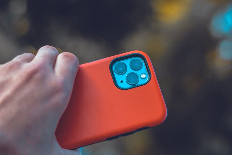 Close-up Of Holding A Iphone 