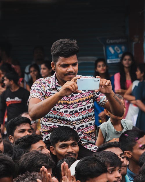 Man Taking Photo with a Cellphone