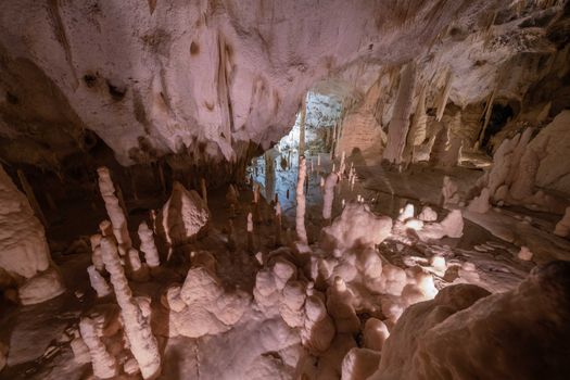 Explore the breathtaking beauty of a cave with fascinating stalactite formations.