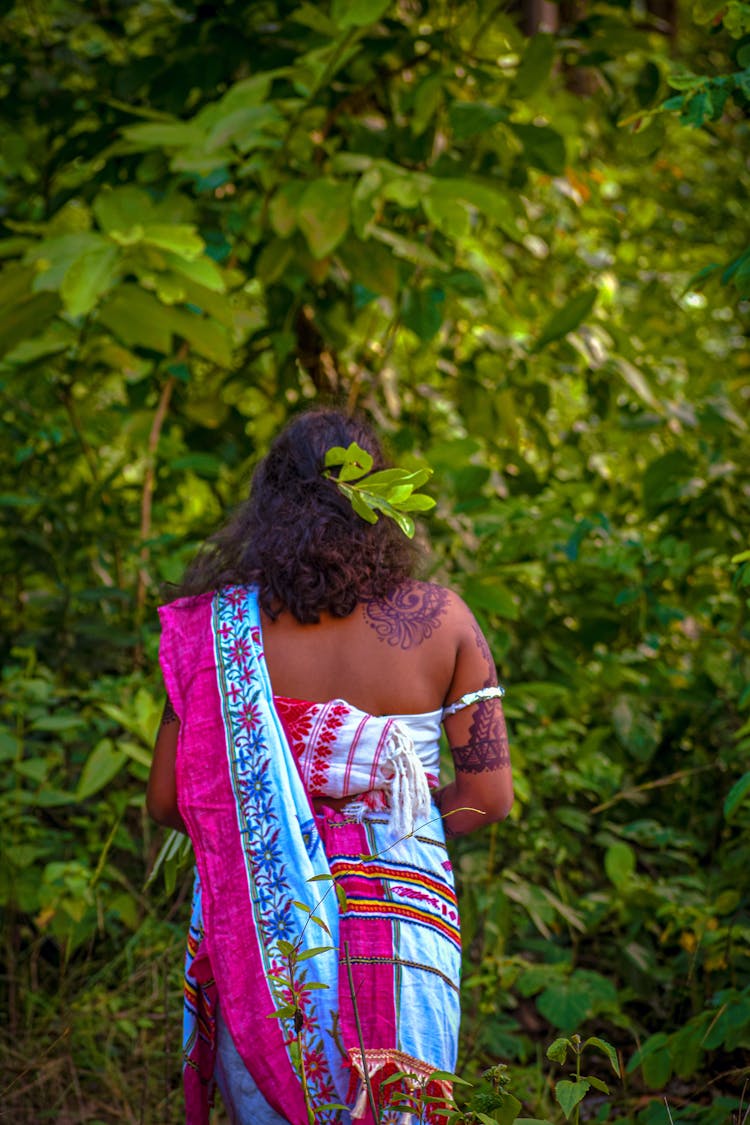 Back View Of A Woman In A Colorful Dress Standing Outdoors 