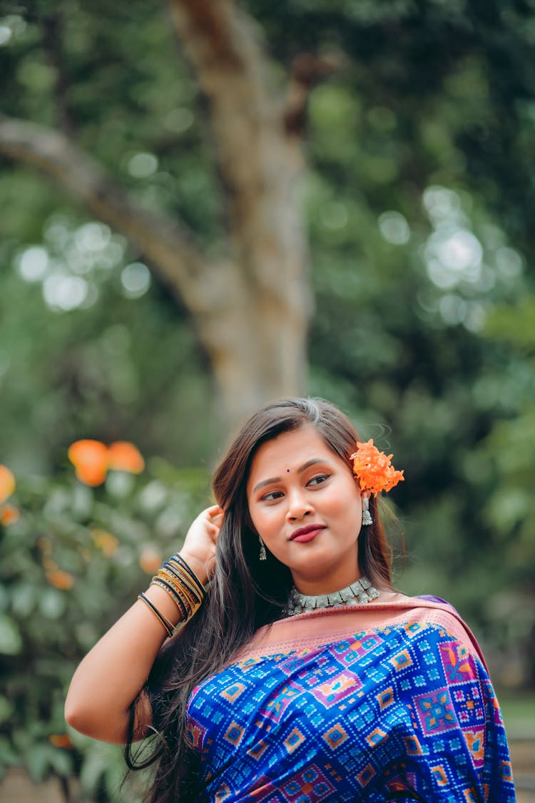 A Woman With Flower Behind The Ear