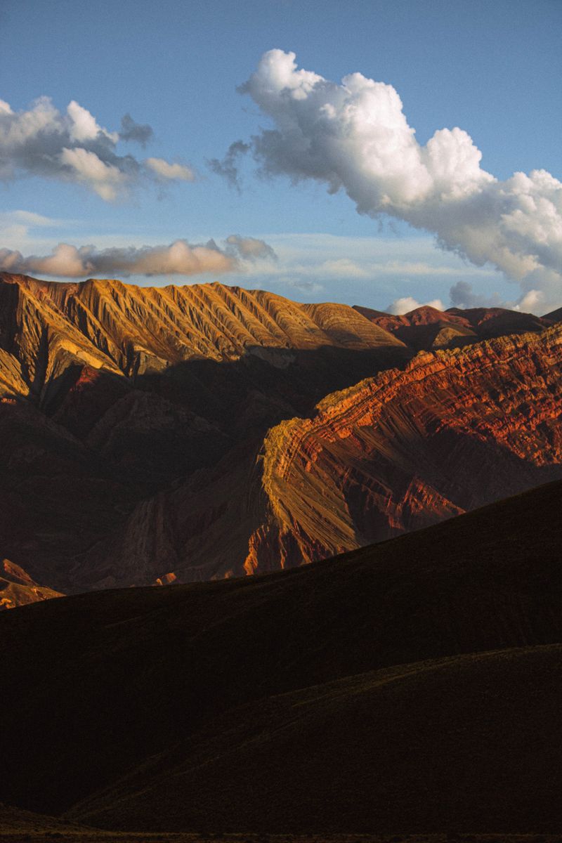 Stunning view of the vibrant, colorful mountains in San Salvador de Jujuy, Argentina at sunset.