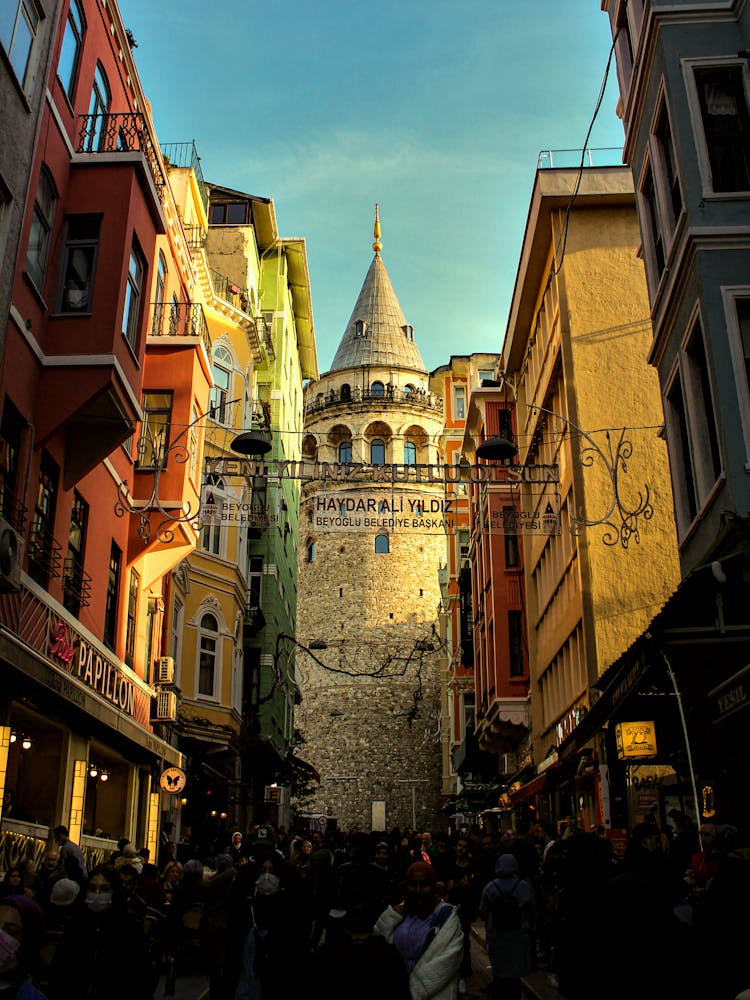 Tourists Sightseeing In Front Of Galata Tower