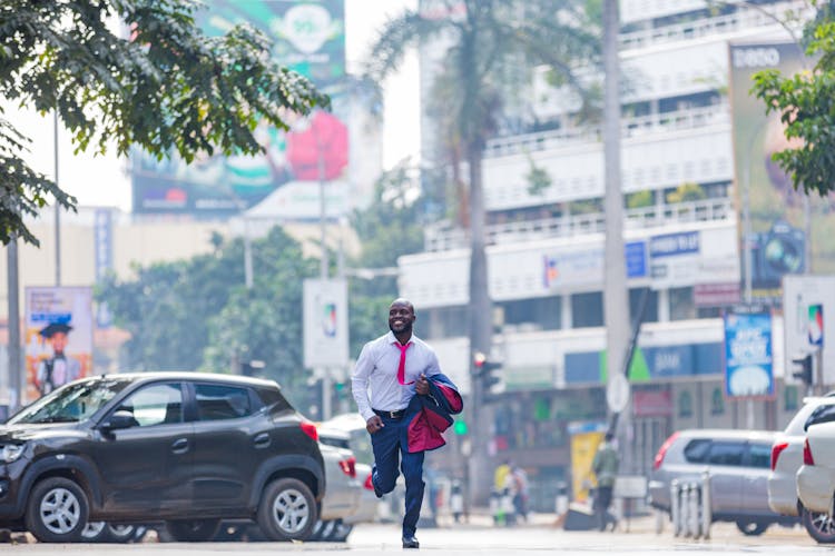 Man In A Suit Running On The Street