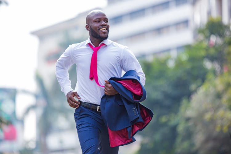 Bearded Man In A Suit Running